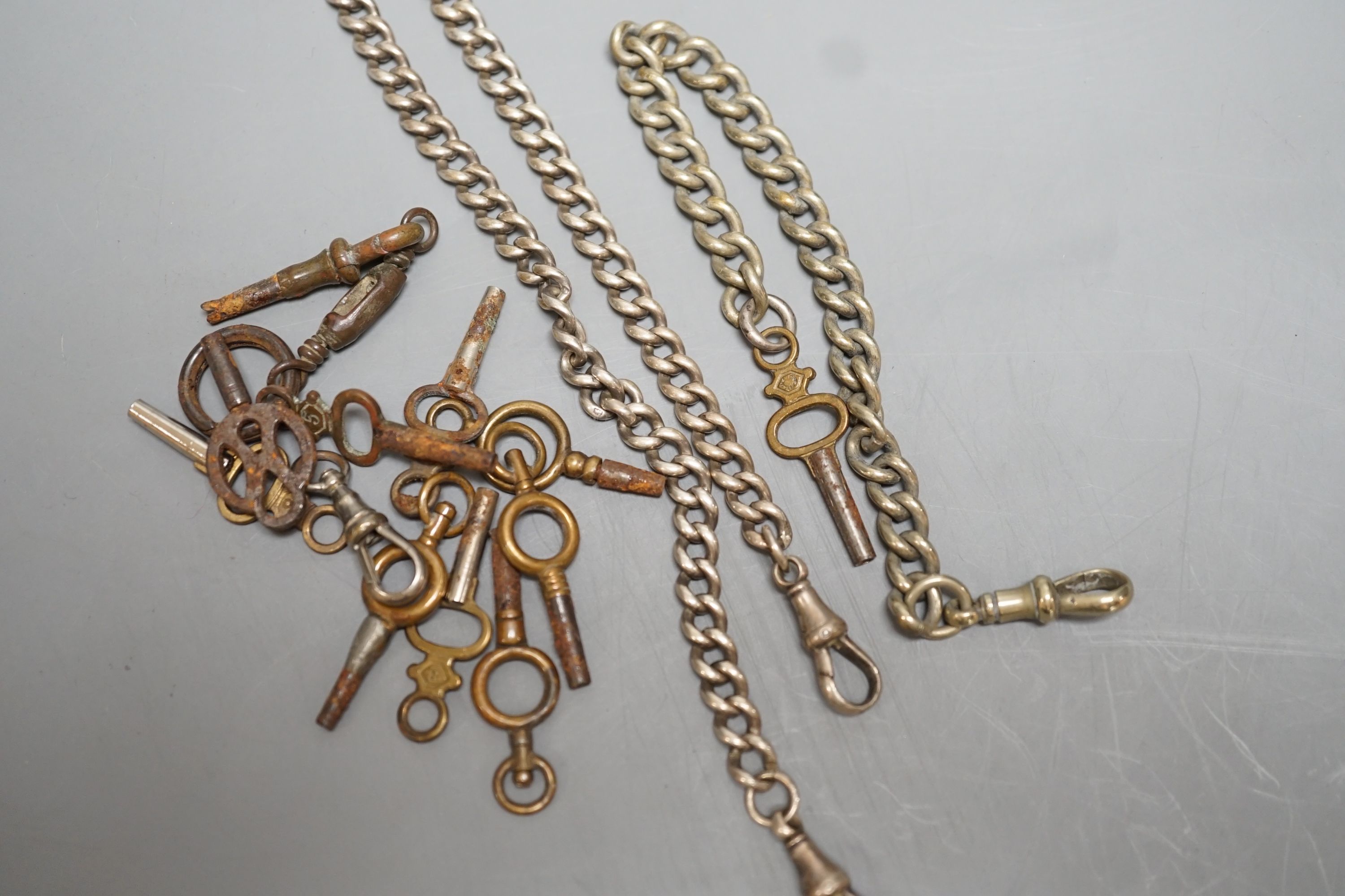 Two silver alberts, one other albert and assorted watch keys.